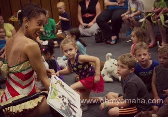 Karilyn reads to children during a Momaha story time in September. 