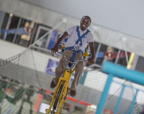 Yeah, you can can a bike on a cable 30 feet in the air at MOSI. Photo courtesy MOSI