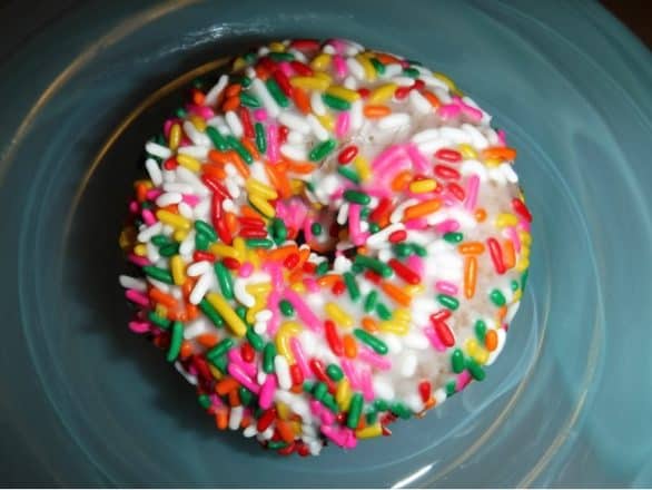 A vanilla-frosted cake donut with sprinkles from Jitters in Sioux City, Iowa