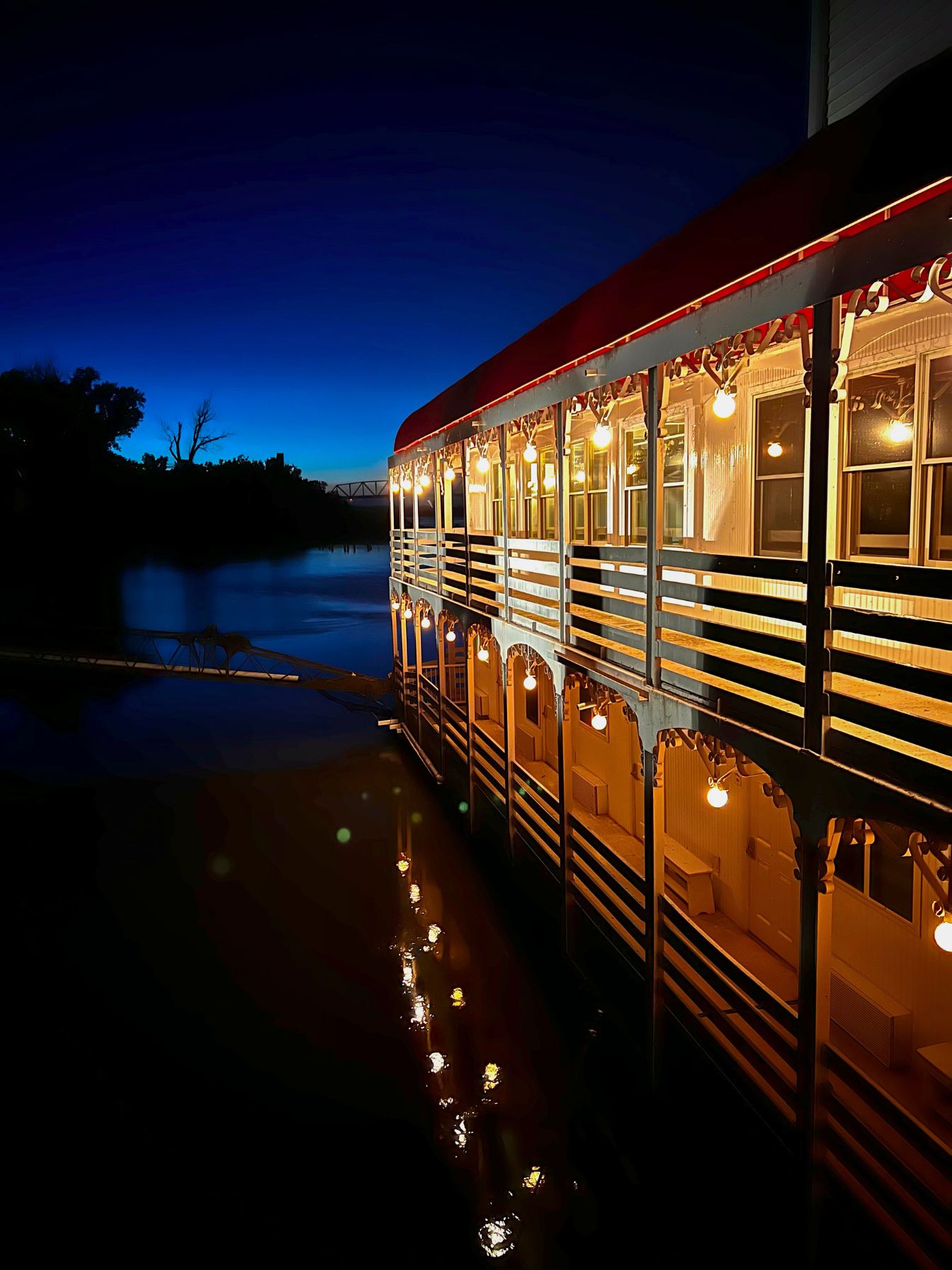 The River Inn in Brownville lit up at night