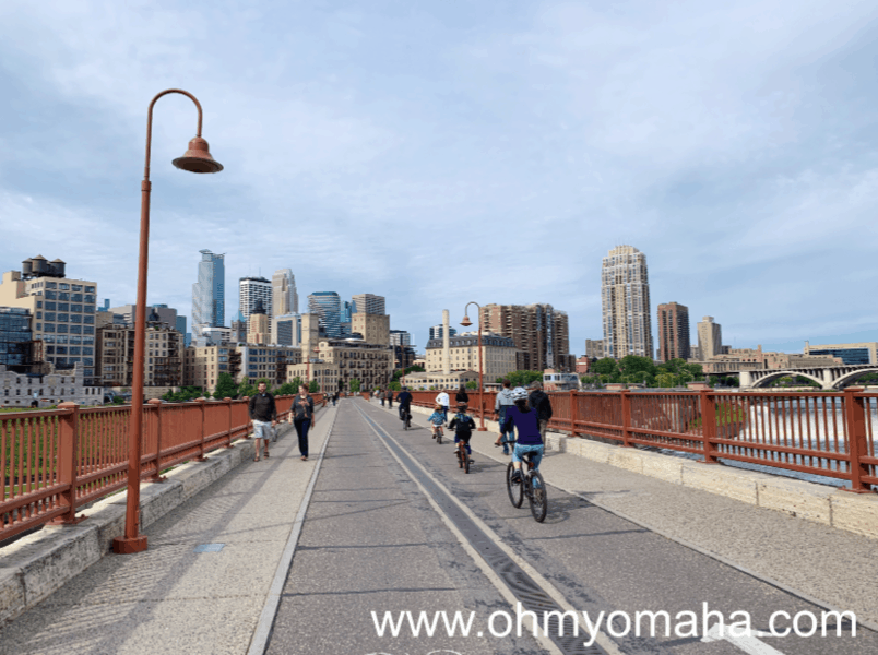 Things to do with kids in Minneapolis - Bike alone the Stone Arch Bridge,  pedestrian bridge in downtown Minneapolis