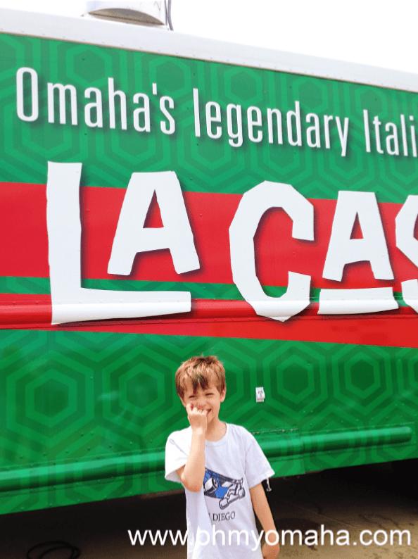 Boy in front of the La Casa food truck in Omaha