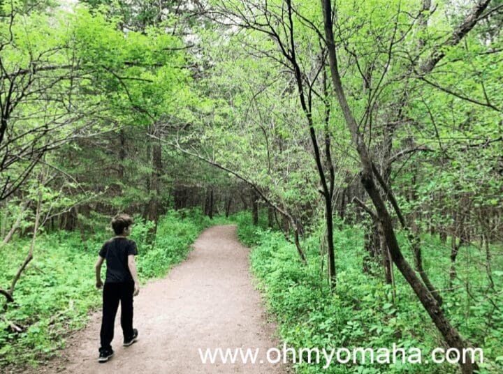 A boy on a trail at Schramm Park in Nebraska