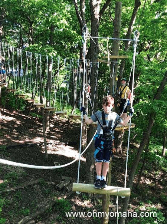 Boy on the swing obstacle at TreeRush Adventures
