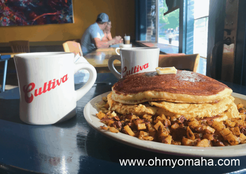 Coffee and Johnny Cakes at Cultiva in Lincoln, Nebraska. Johnny Cakes are like pancakes except they're made with cornmeal.