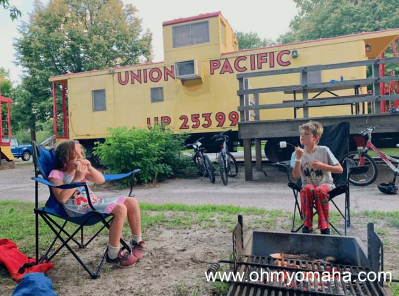 Kids in front of a caboose at Two Rivers State Recreation Area in Nebraska