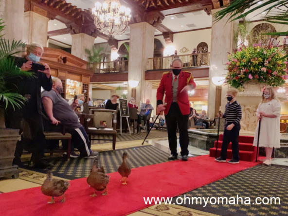The Duck Master and honorary duck master kids walking the Peabody Hotel ducks.