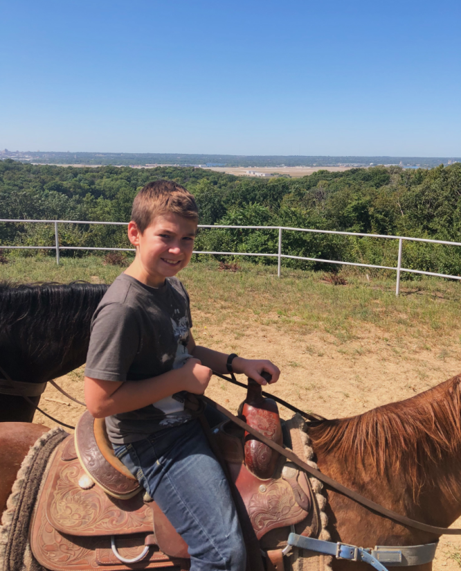 Boy on a horse at Shady Lane Ranch in Council Bluffs, Iowa.