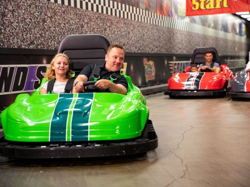 Families driving go carts at the Amazing Pizza Machine