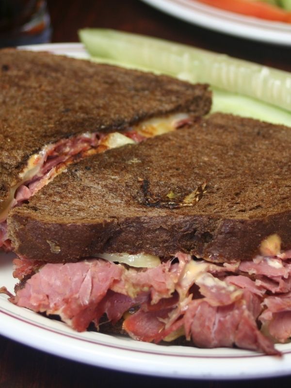 Reuben sandwich with a dill pickle spear