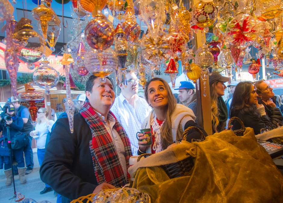 A couple browses a booth at Denver Christkindl Market.
