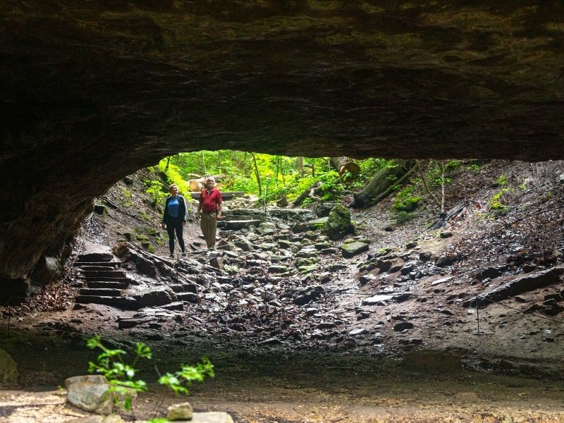 Hikers in a cave at Ha Ha Tonka State Park