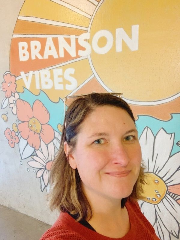 A selfie in front of Branson Vibes,  one of the murals at Branson Landing