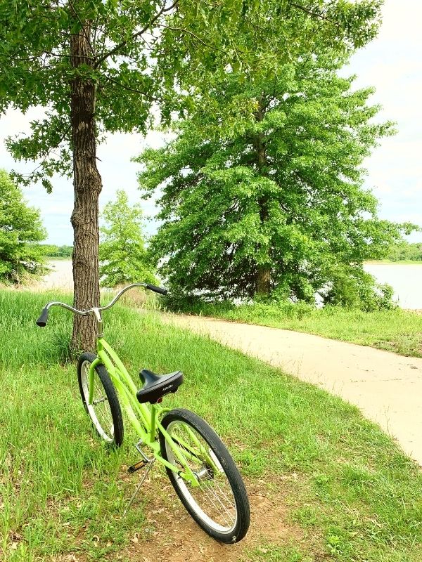 A green bike by a path near Rathbun Lake