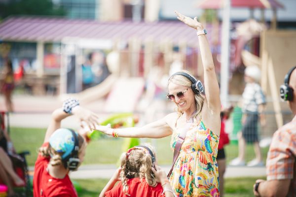 Parent with Child dancing at the SIlent Disco at Maha Festival 2021 - Ben Semisch