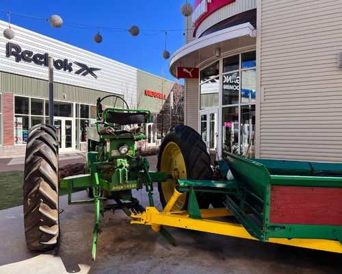 Green tractor climbing area by the Reebok store at Nebraska Crossing Outlets 