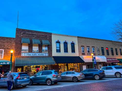 Shops along the brick road of Silver Street at dusk in Ashland, Nebraska
