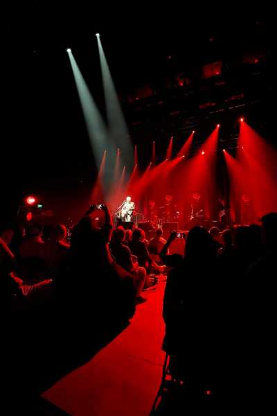 Elvis Costello in the spotlight on stage at the Steelhouse Omaha 