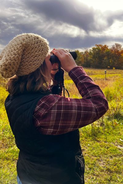 Kim tries bird watching on a fall day at Jefferson County Park in Fairfield, Iowa