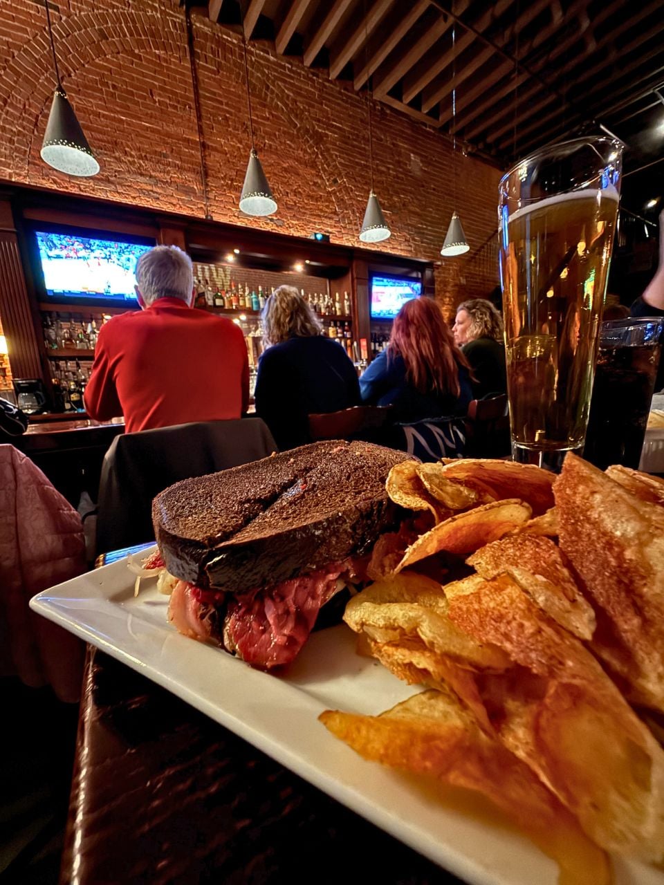 A Reuben sandwich, chips and a tall beer at Wilson and Washburn in Omaha