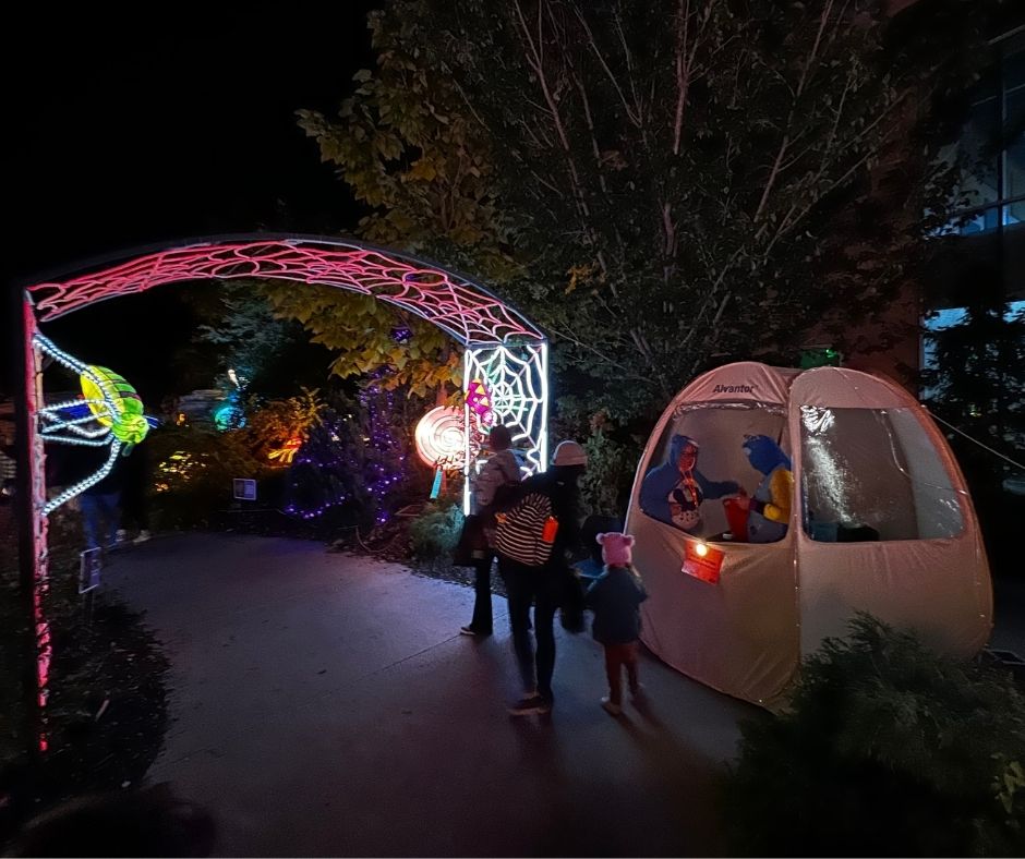 A family trick or treats at night at Omaha's Henry Dourly Zoo & Aquarium