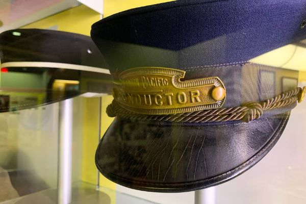A blue hat with "Union Pacific Conductor" on it