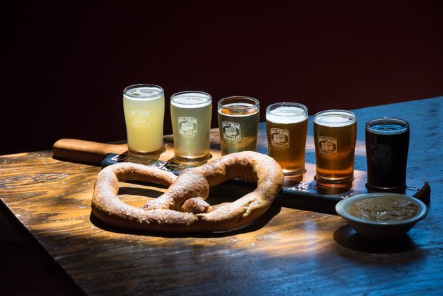 A flight of beer and Bavarian pretzel at Millstream Brewery