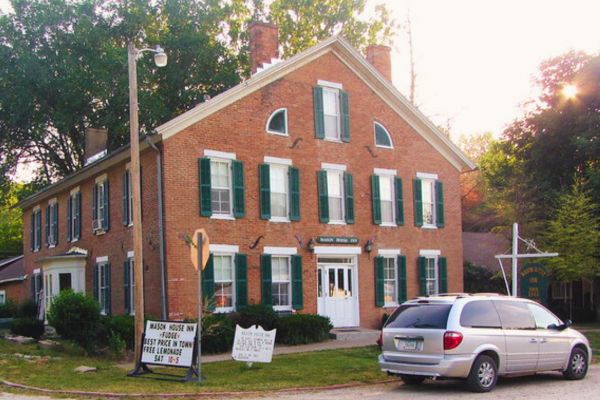 Brick exterior of the Mason House Inn and Caboose Cottage in Bettensport