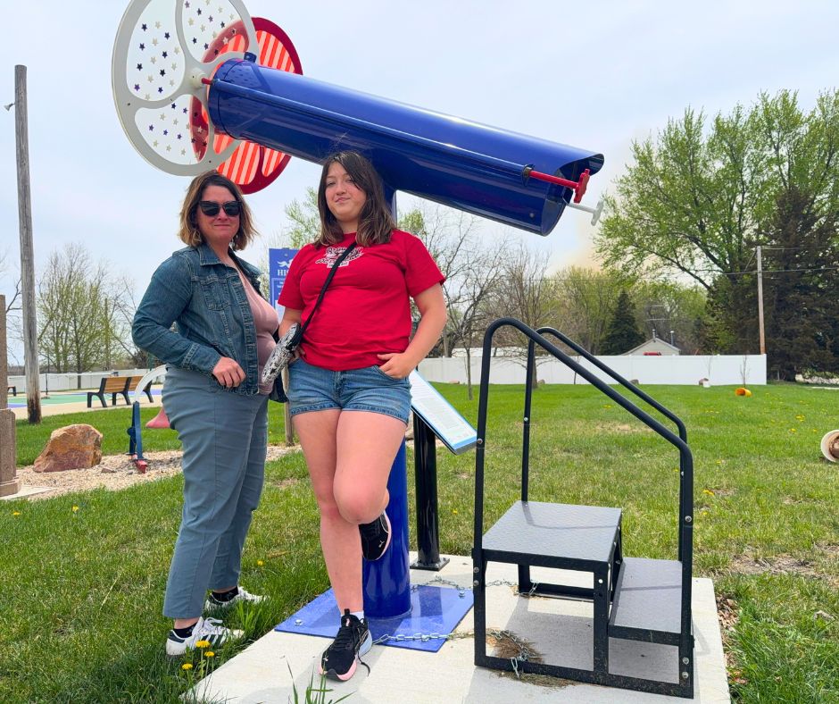 Kim and her daughter stand near a red, white and blue kaleidoscope in Varina, Iowa
