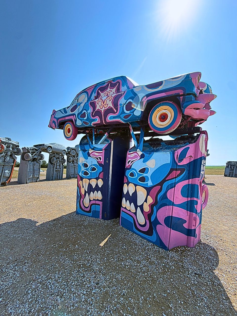 A portion of Carhenge that was painted by a local artist.