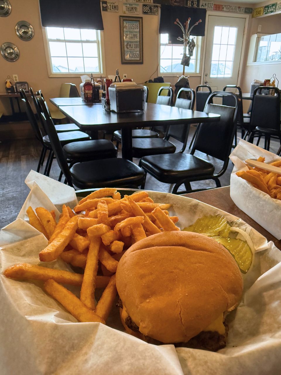 A basket with a cheeseburger and fries at HWY 7 in Fonda, Iowa
