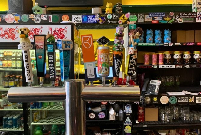The eclectic barware on display behind the bar at Fong's Pizza in Des Moines