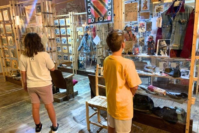 Two kids look at displays at The Hobo Museum in Britt, Iowa