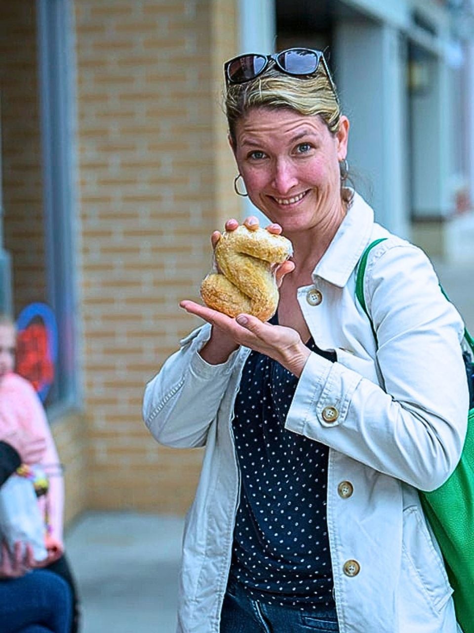 Kim holds a Dutch letter pastry