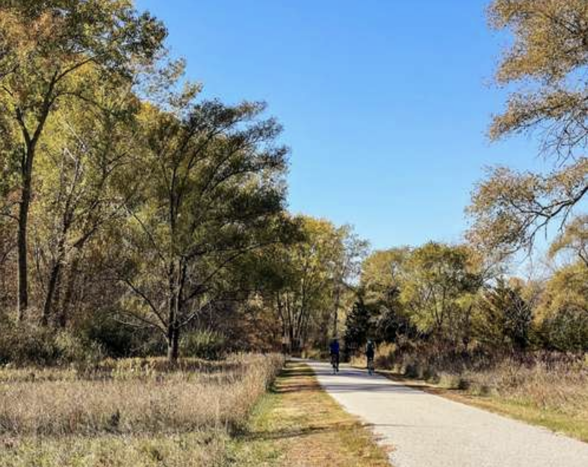 Two bikers on the paved Lake Manawa Loop Trail